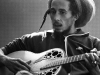 bob marley playing guitar